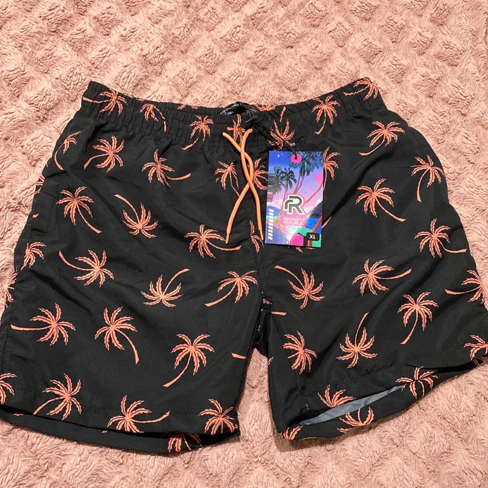 Black swimming trunks with coral palm trees
